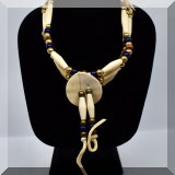 J105. Choker necklace with bone, metal and blue beads suede tie. - $38 